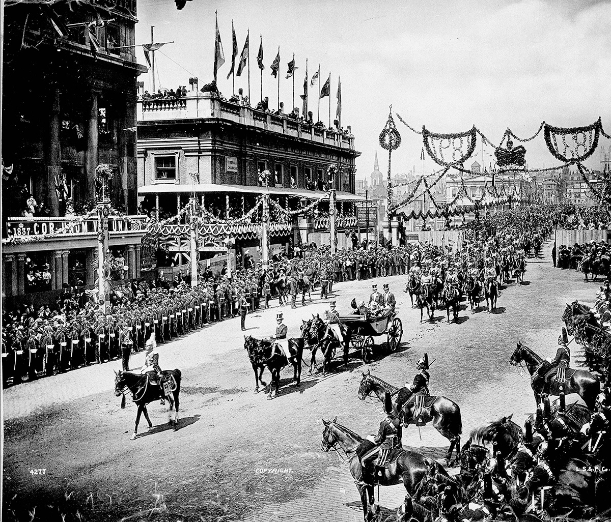 A black and white image of a parade.