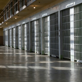A row of empty jail cells.
