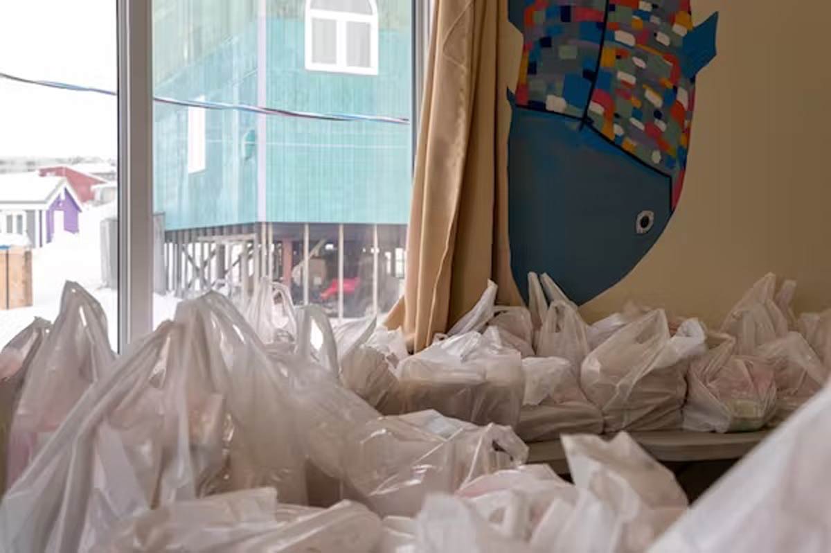 Plastic bags sitting on a table in front of a window