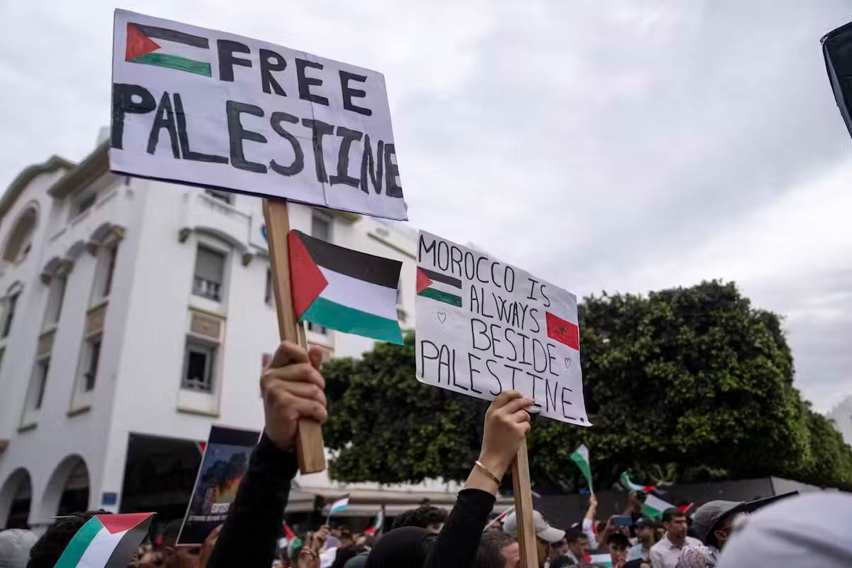 A protester holds up a sign that says Free Palestine