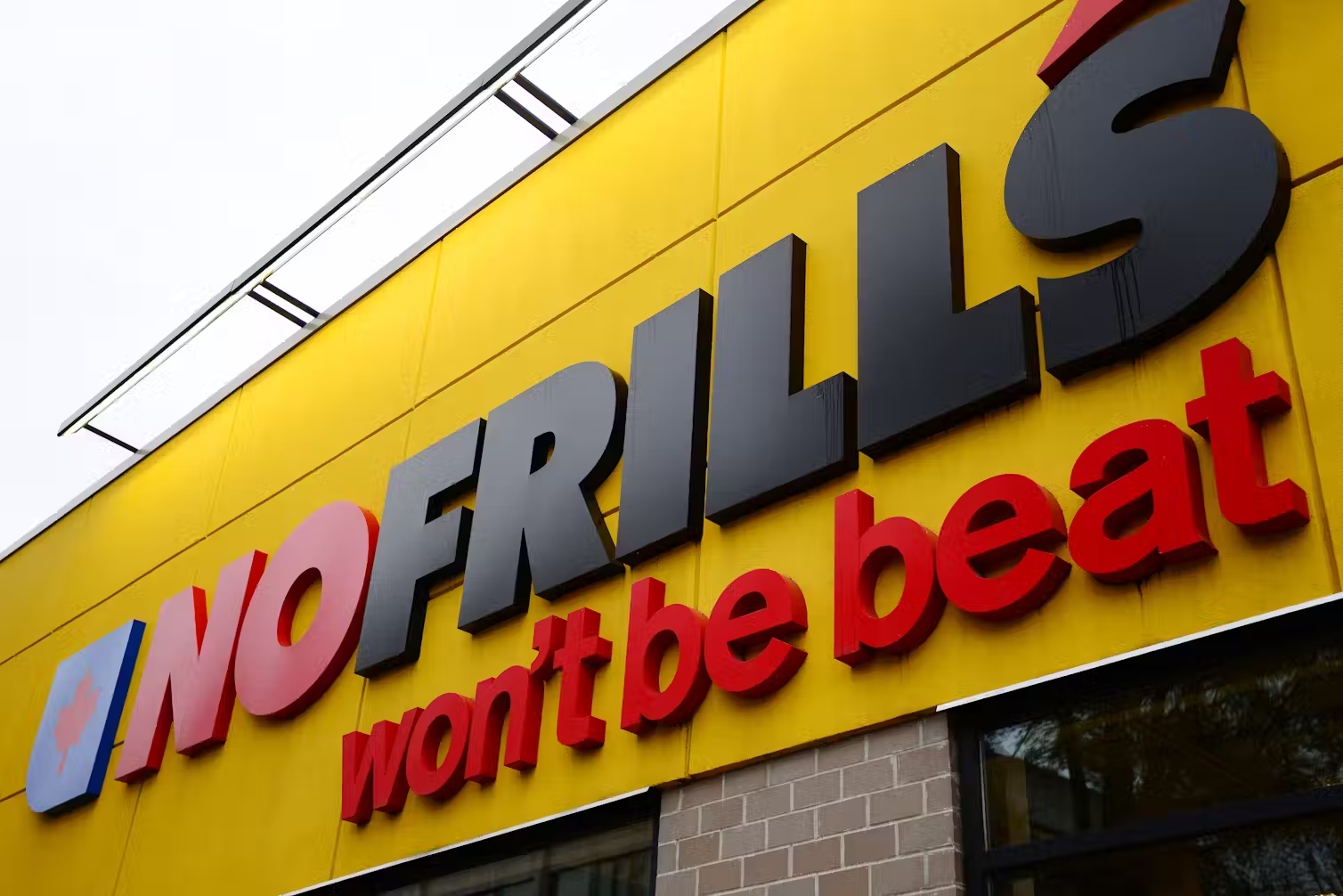 A close-up of the front of a No Frills store.