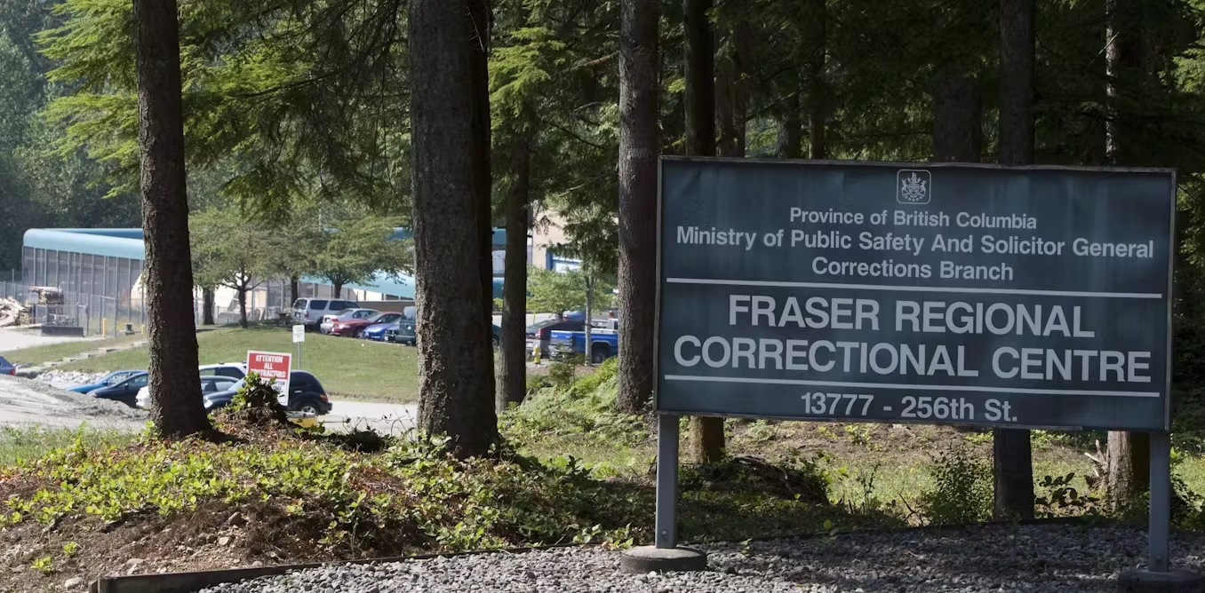A sign for the Fraser Regional Correctional Centre in front of the correctional centre grounds in Maple Ridge, British Columbia.